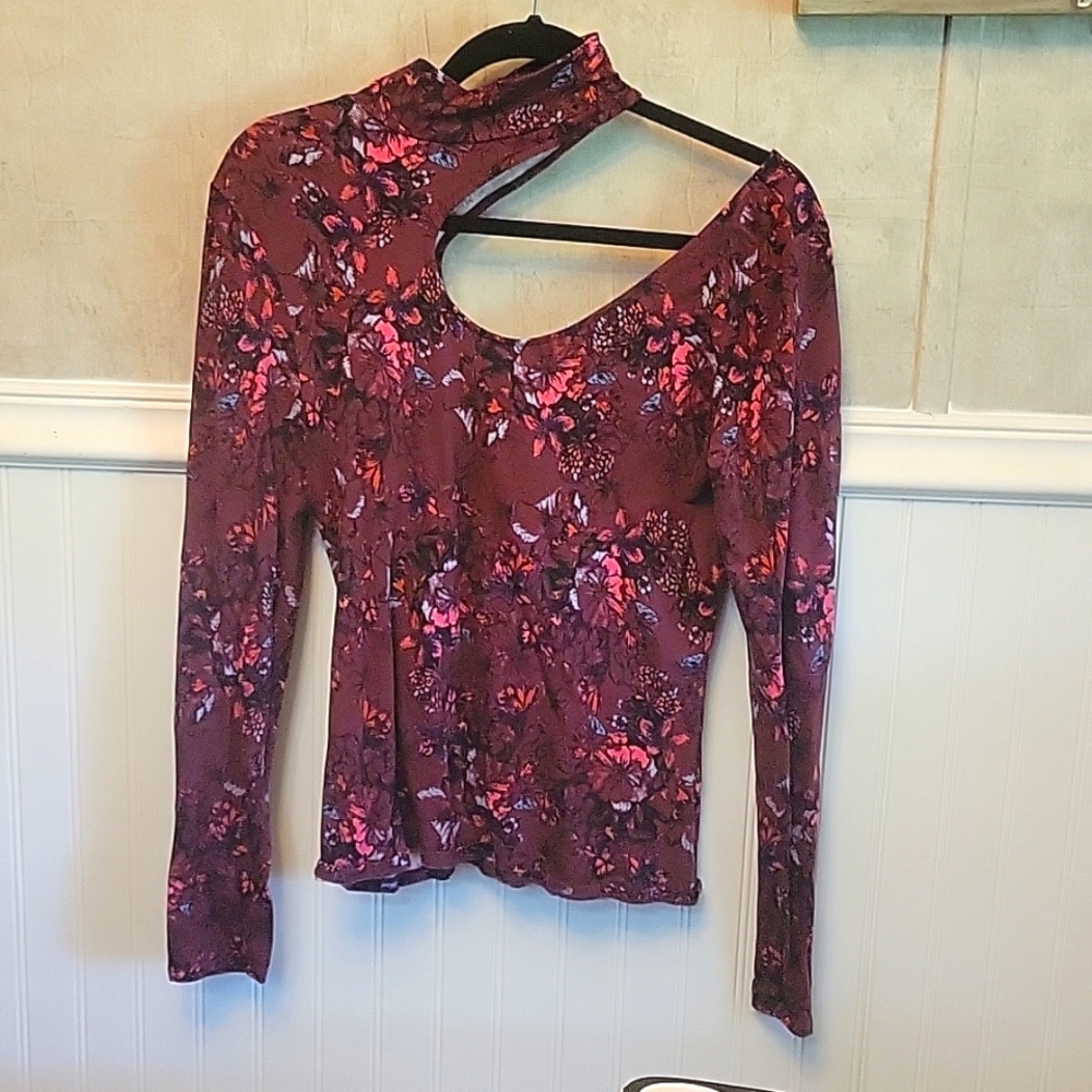 Guess long sleeve open on one shoulder and gently worn